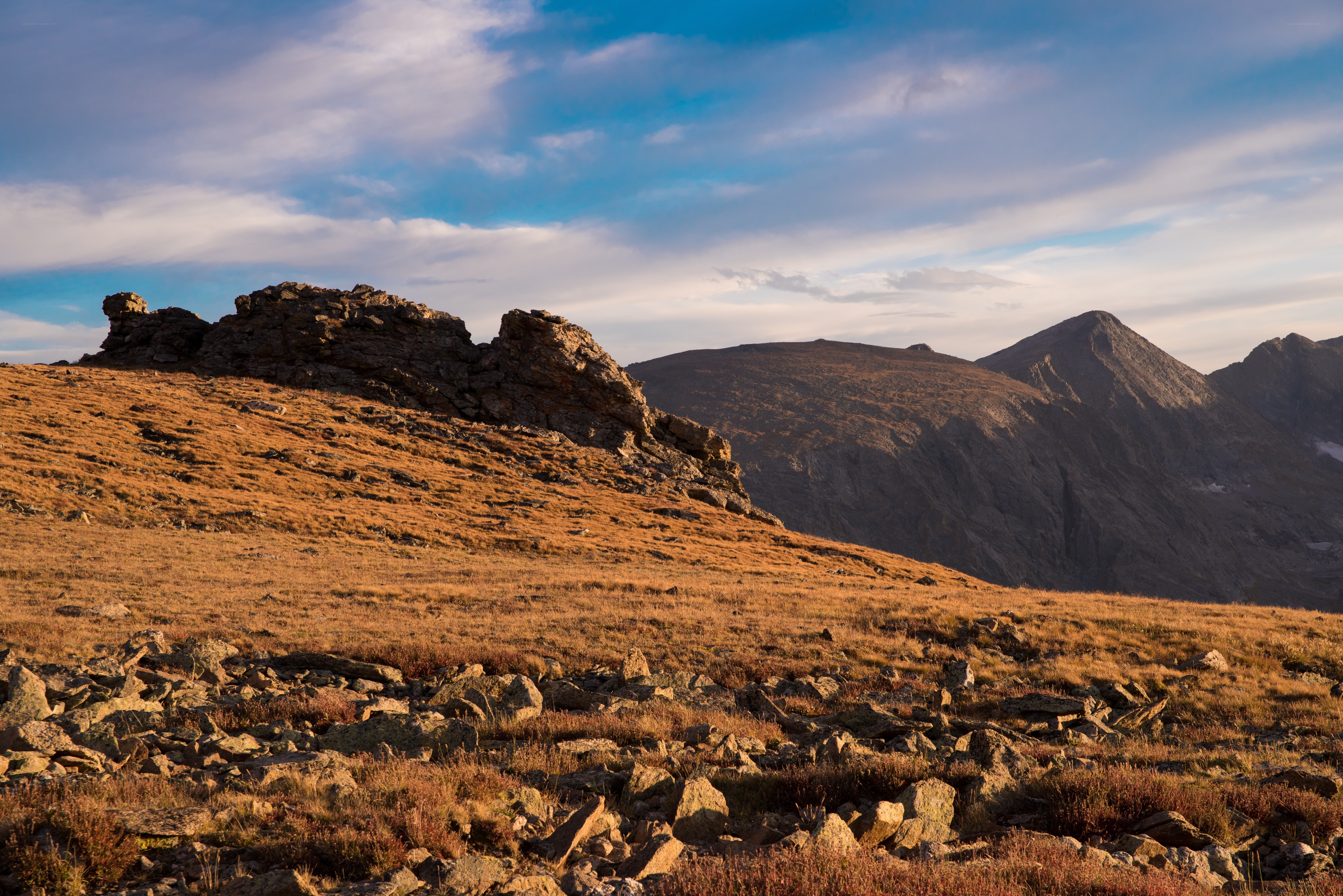 Sunlit mountain ridge at dusk