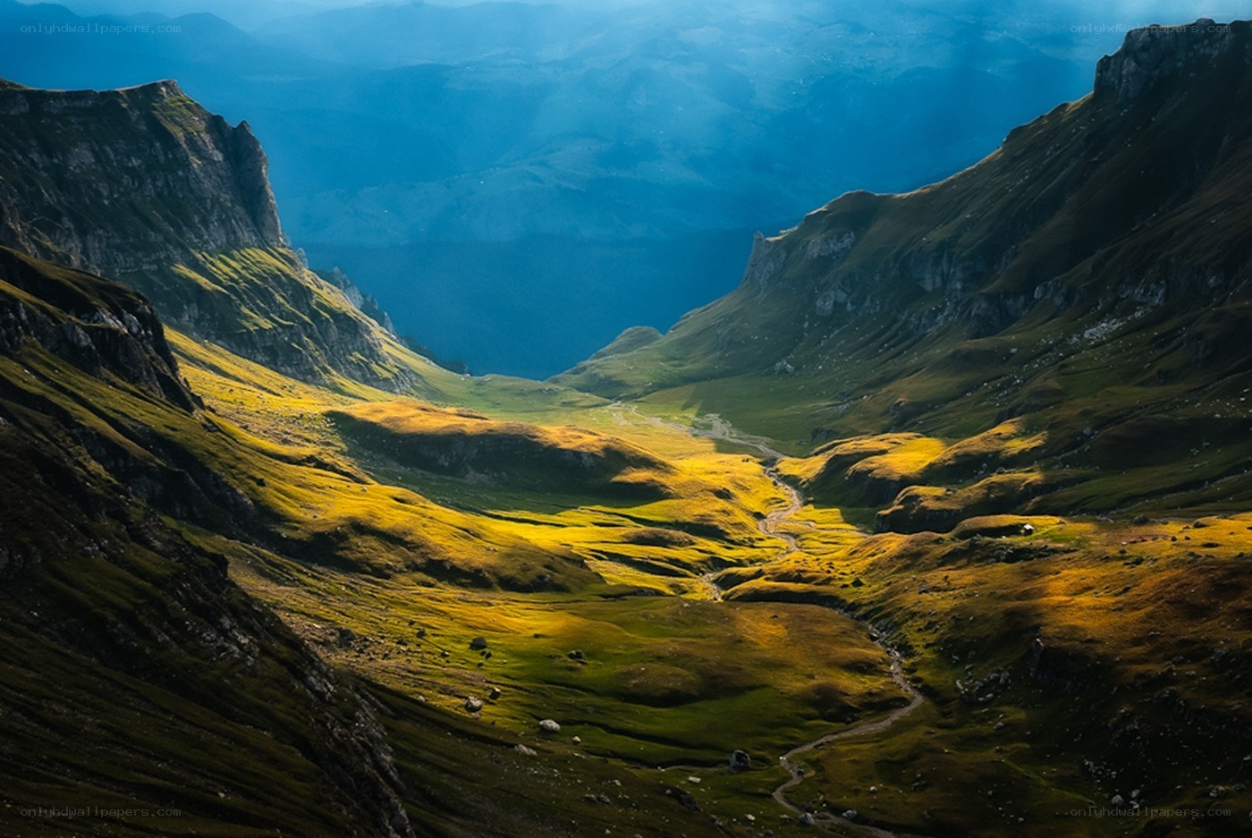 Sunlit mountain valley