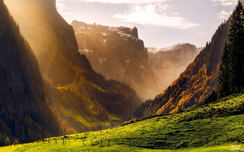 Sunlit mountain valley in autumn