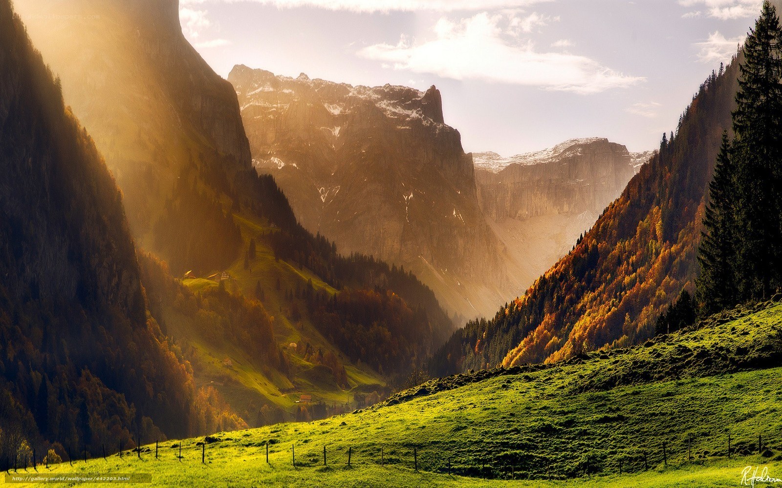 Sunlit mountain valley in autumn