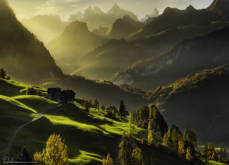 Sunlit mountain valley landscape