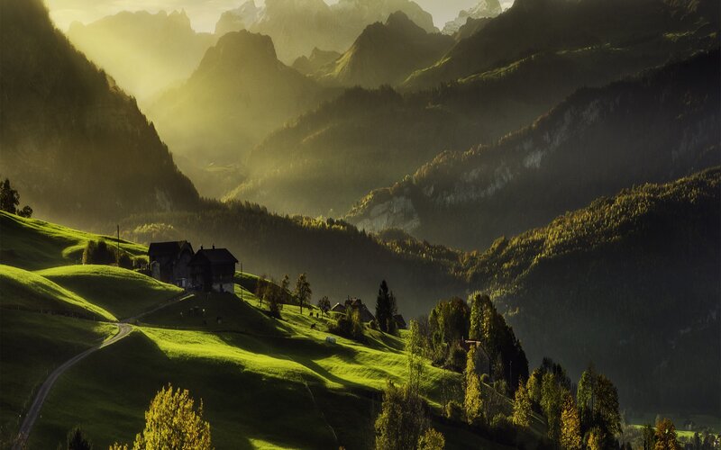 Sunlit mountain village at dawn