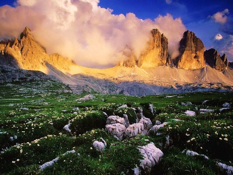 Sunlit mountains with clouds