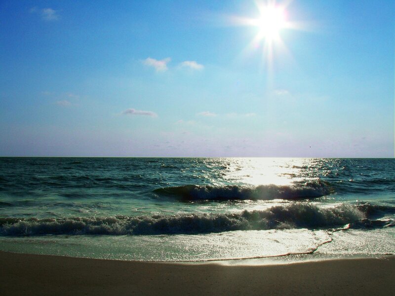 Sunlit ocean waves on a clear day