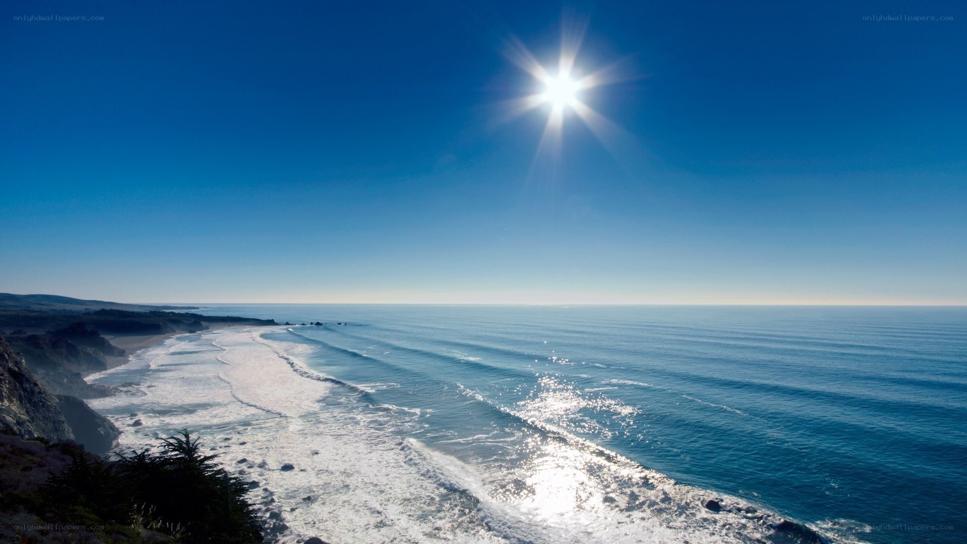 Sunlit ocean waves on a clear day