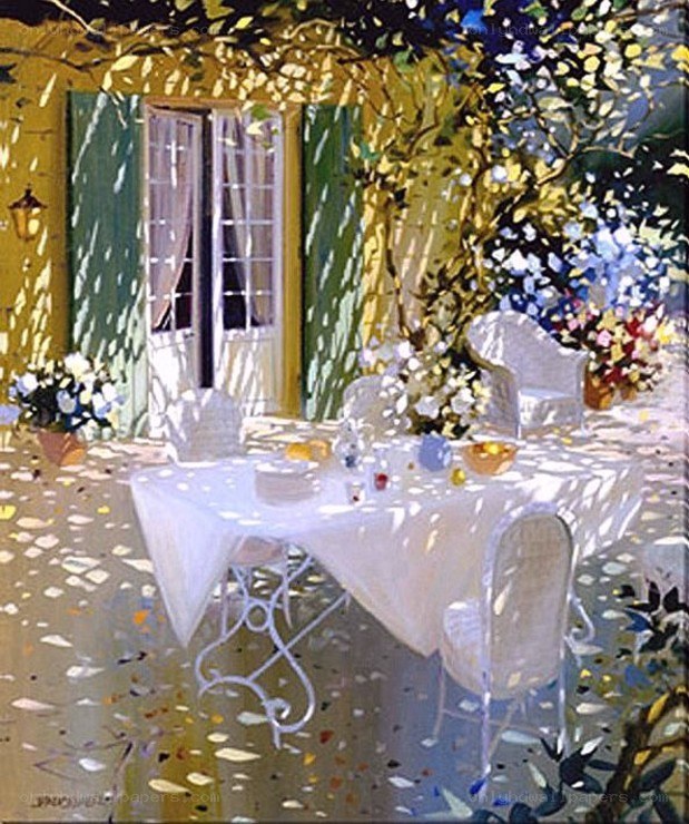 Sunlit patio with table and flowers