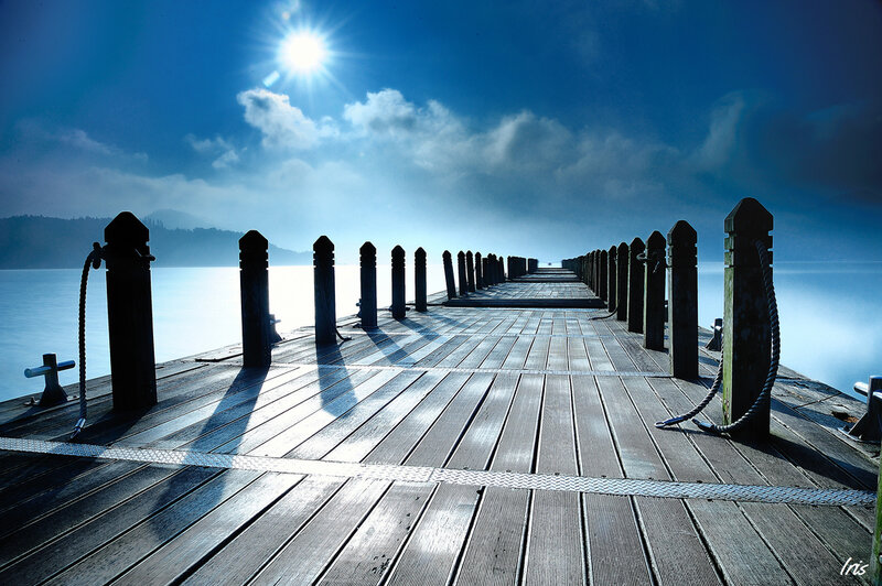 Sunlit pier at dawn