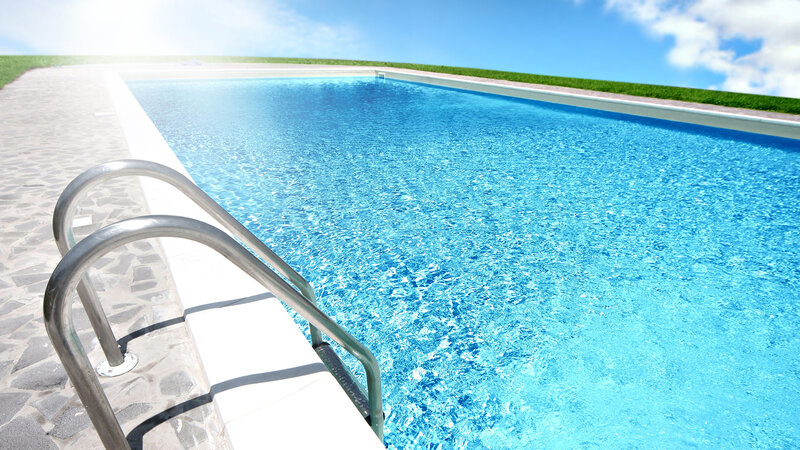 Sunlit pool with ladder