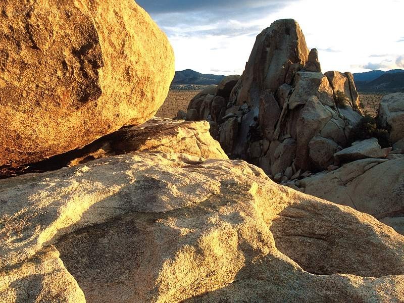 Sunlit rocks in desert landscape