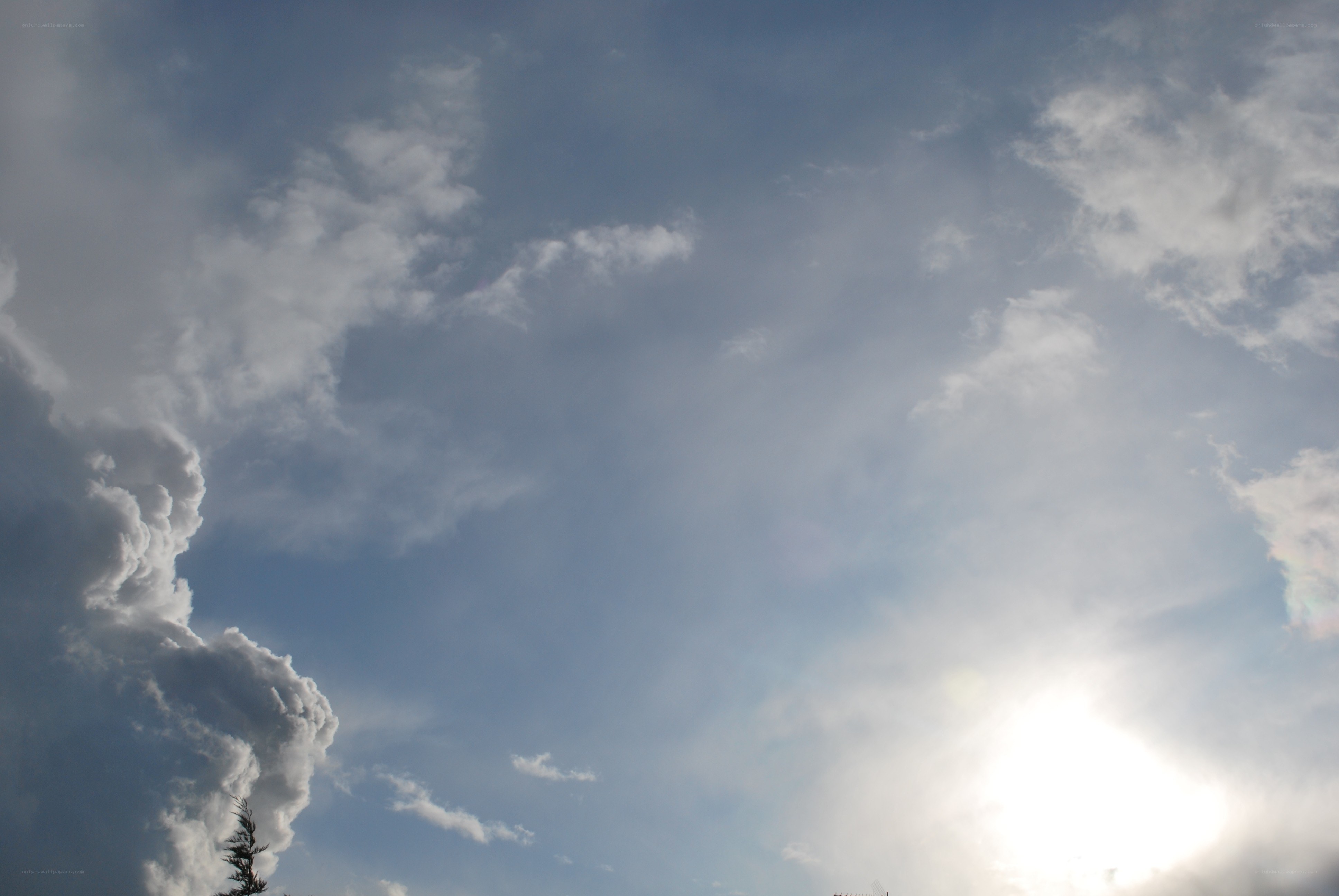 Sunlit sky with clouds