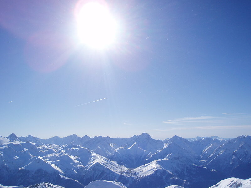 Sunlit snow-capped mountains