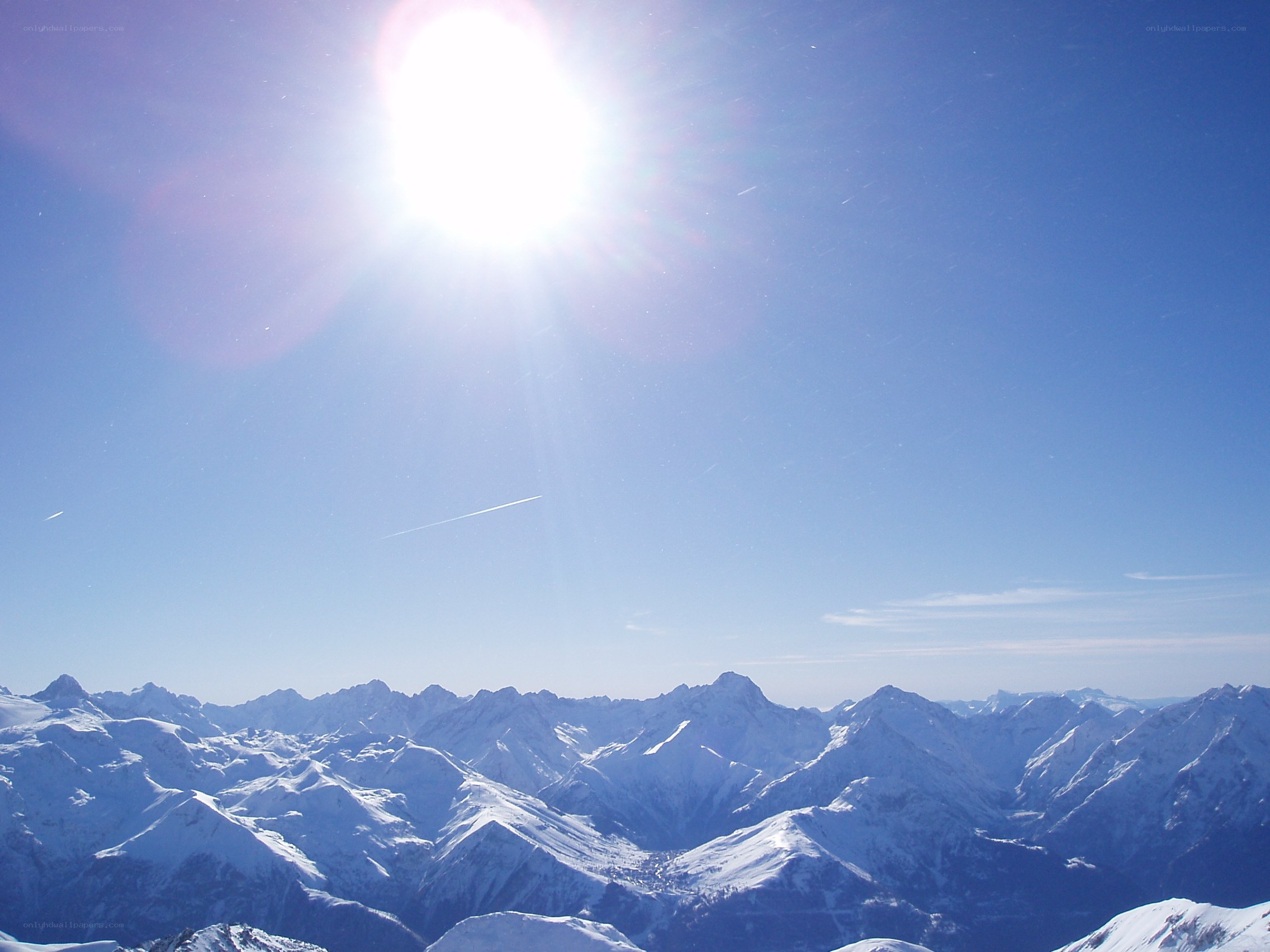 Sunlit snow-capped mountains