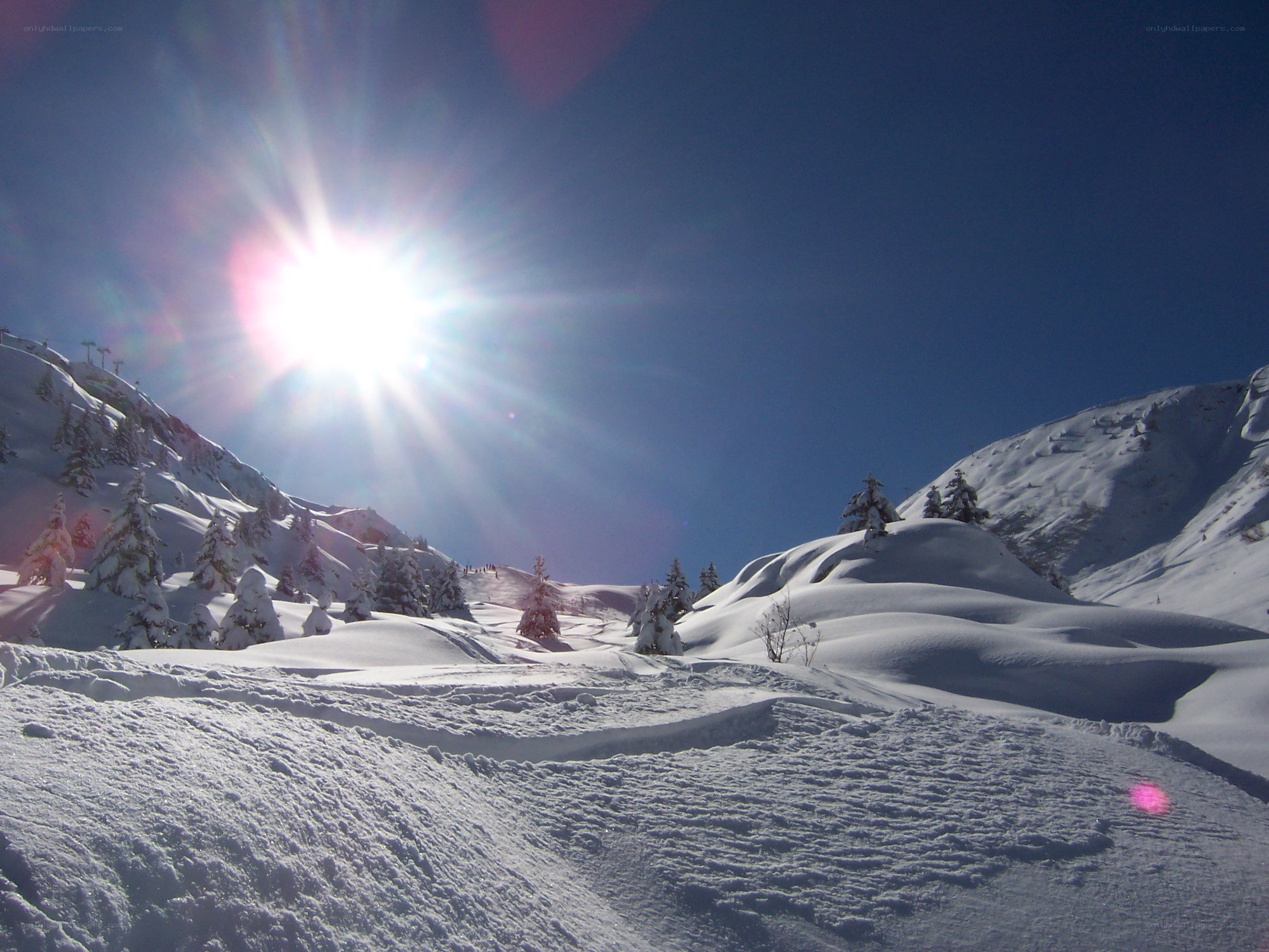Sunlit snow-covered mountain landscape