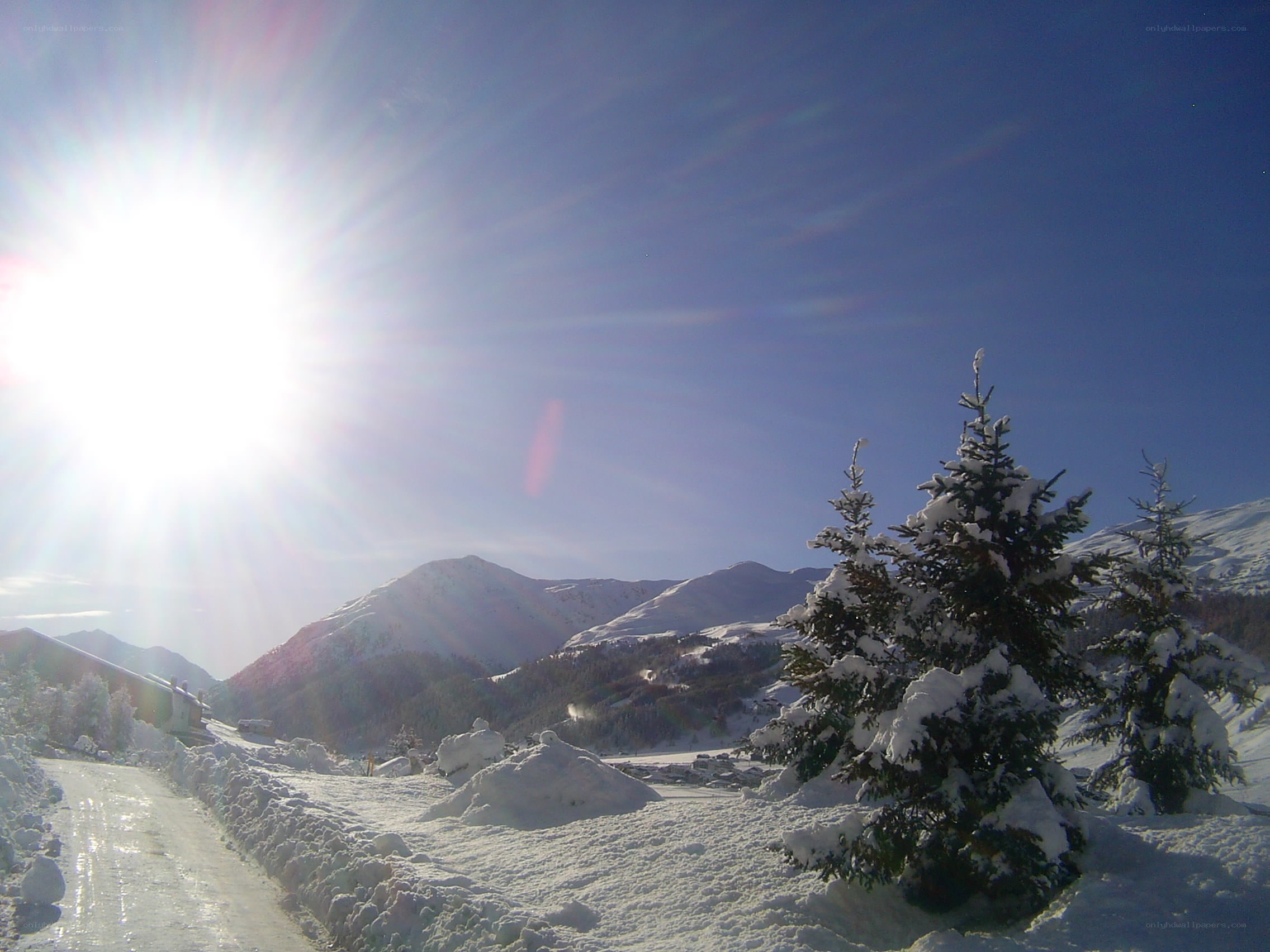 Sunlit snow-covered mountain landscape