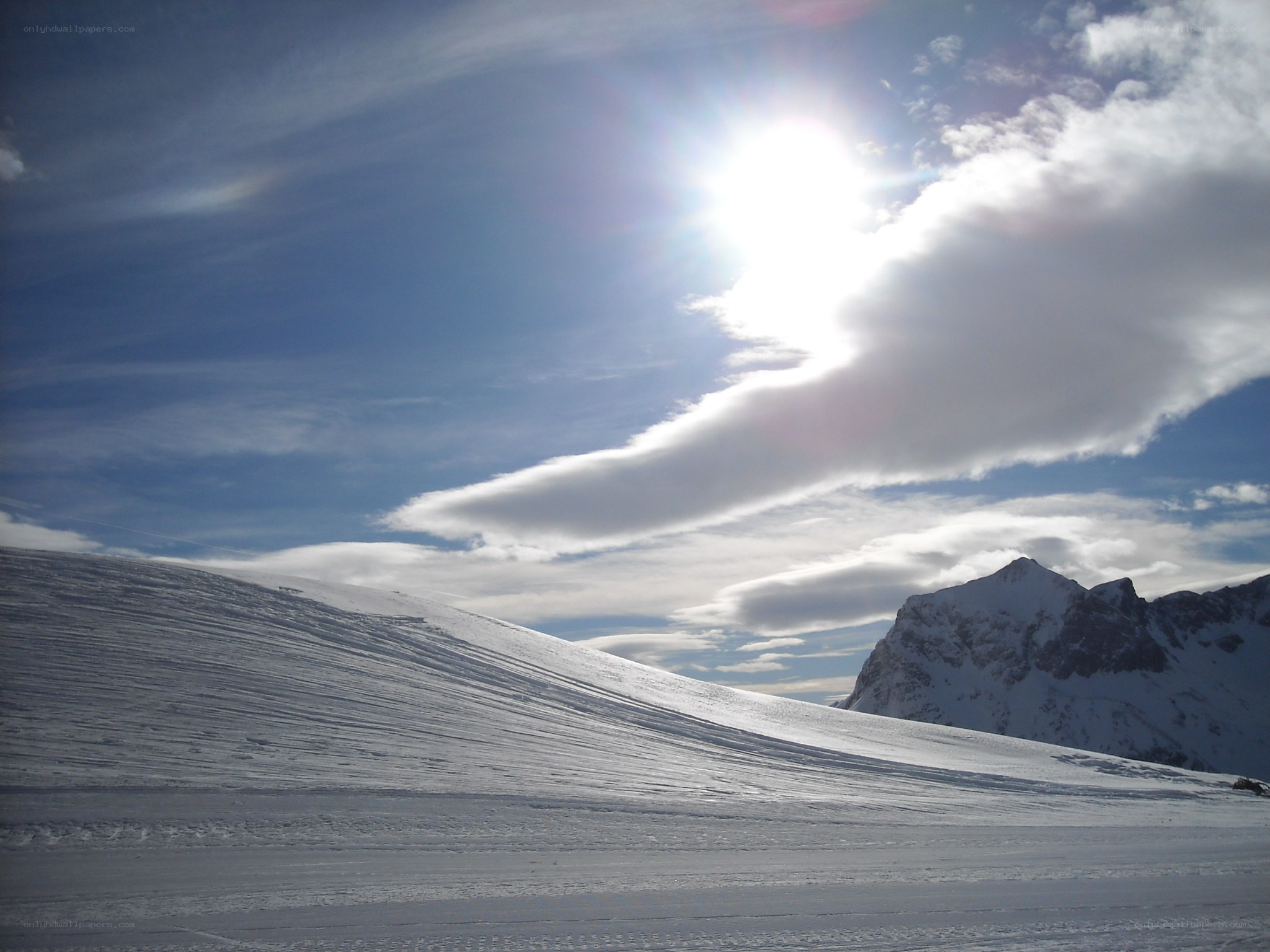 Sunlit snow-covered mountain landscape