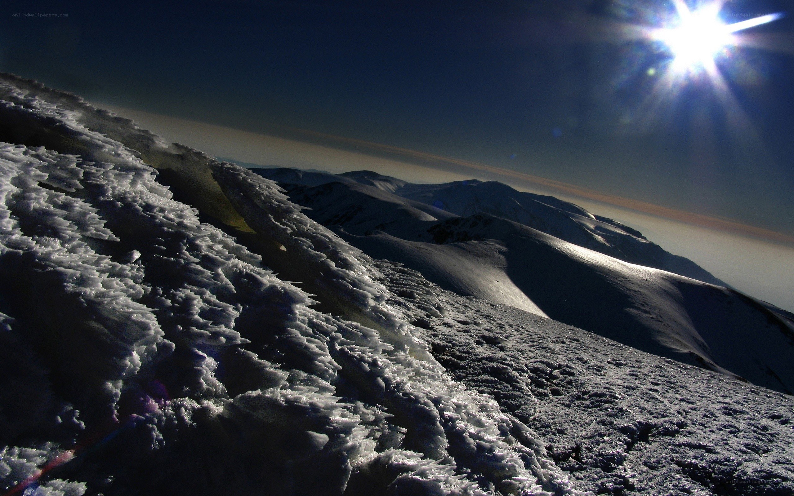 Sunlit snow-covered mountain peak