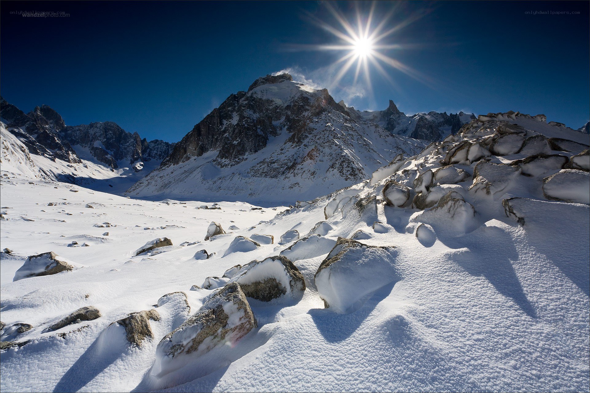 Sunlit snow-covered mountain peak