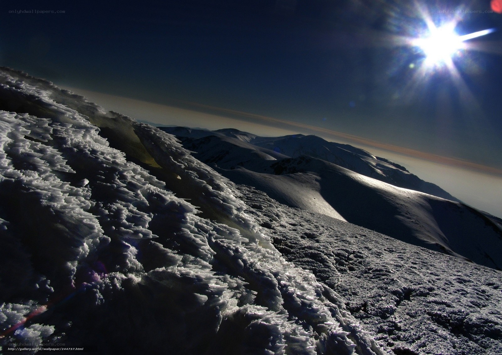 Sunlit snow-covered mountain peak