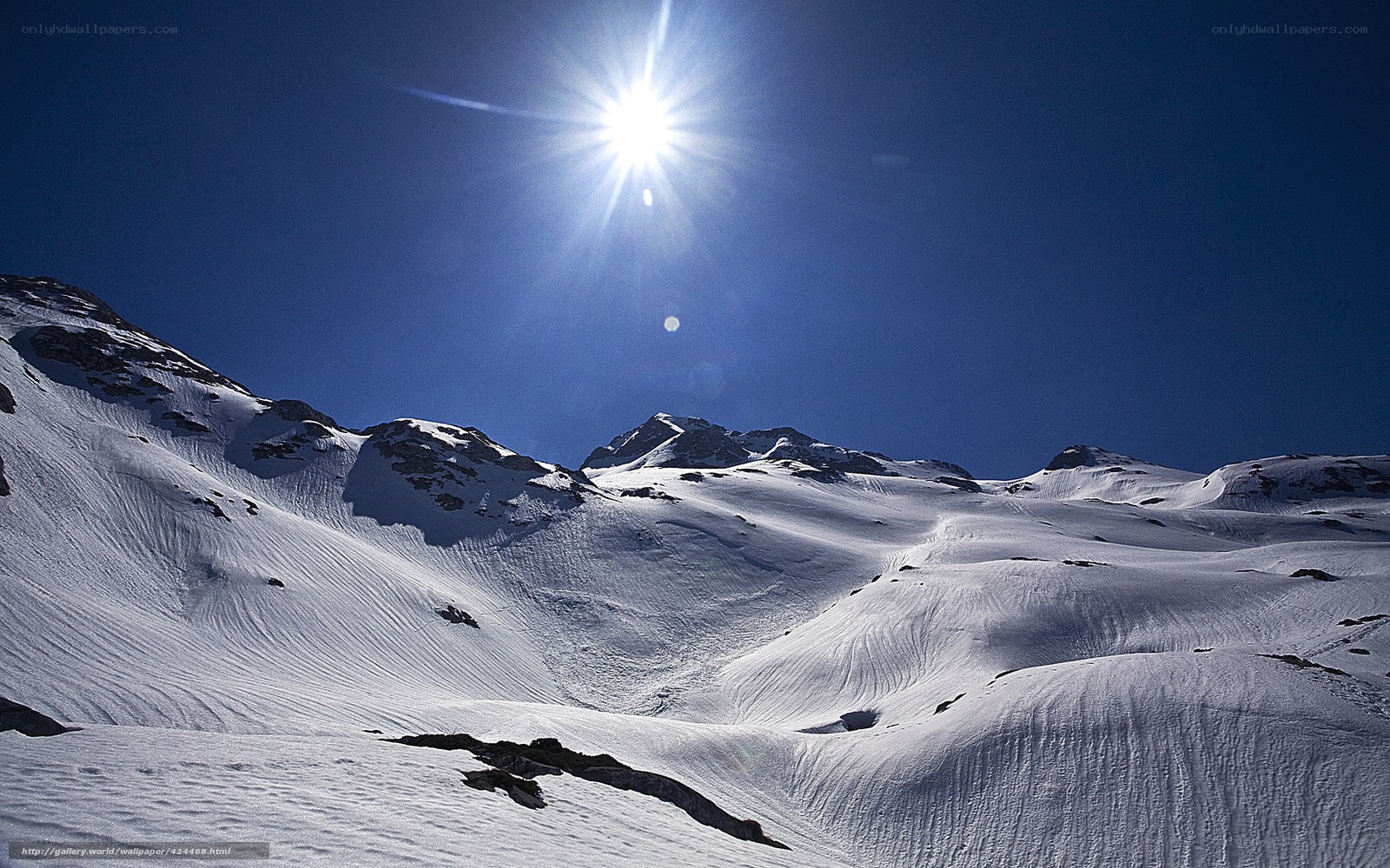 Sunlit snow-covered mountain peaks