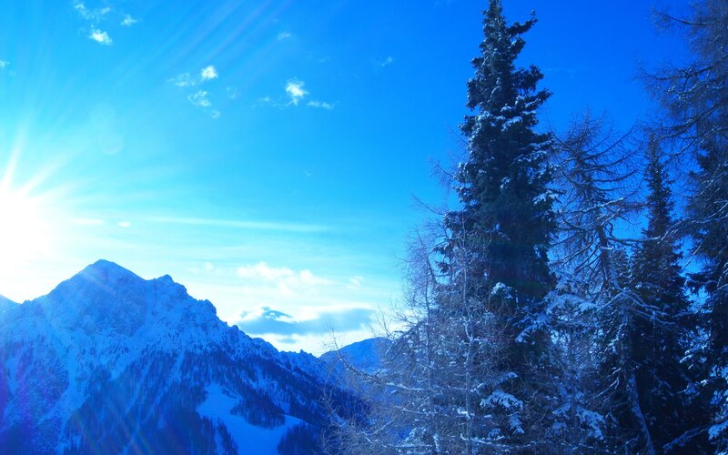 Sunlit snow-covered mountains