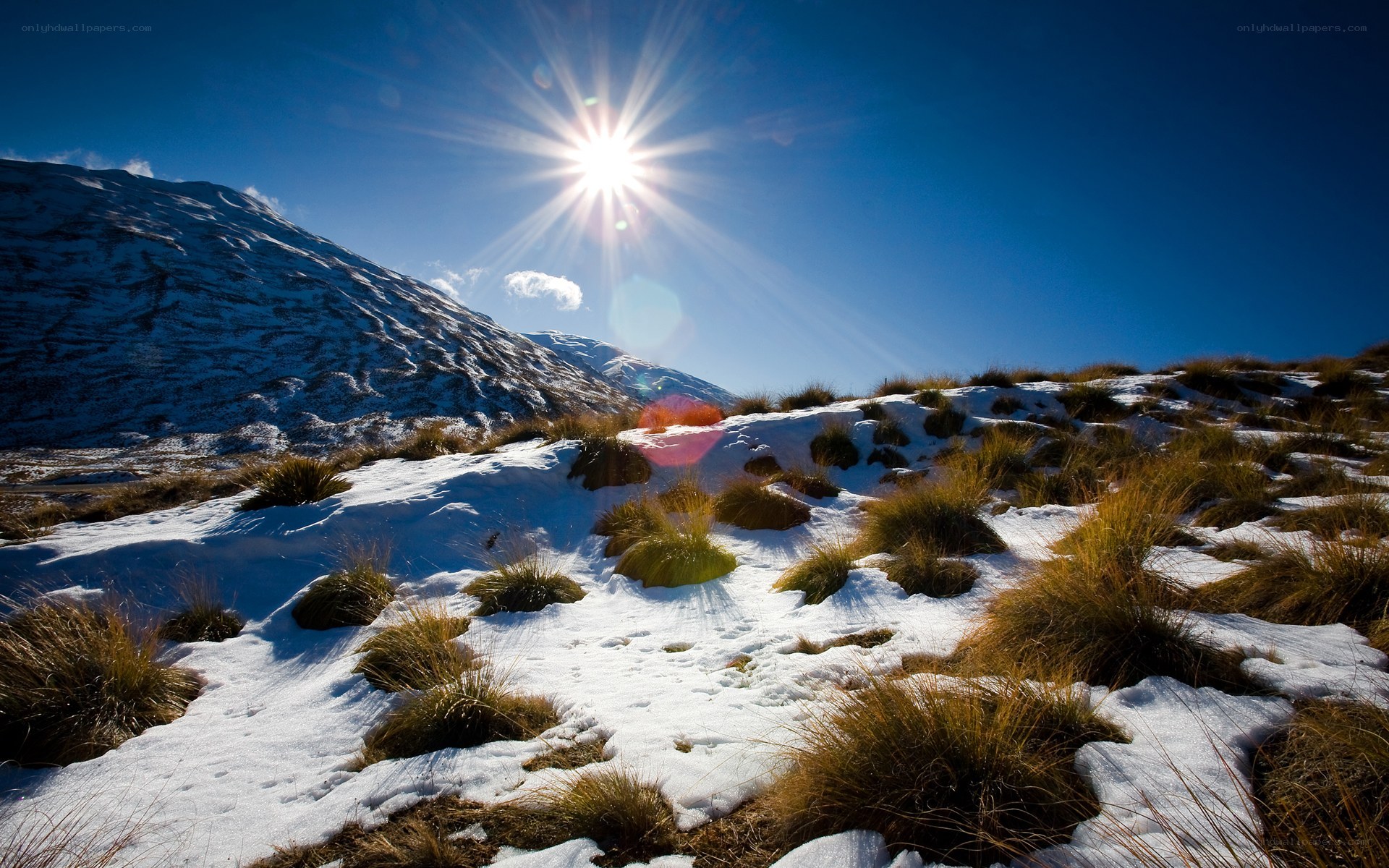 Sunlit snowy mountain landscape