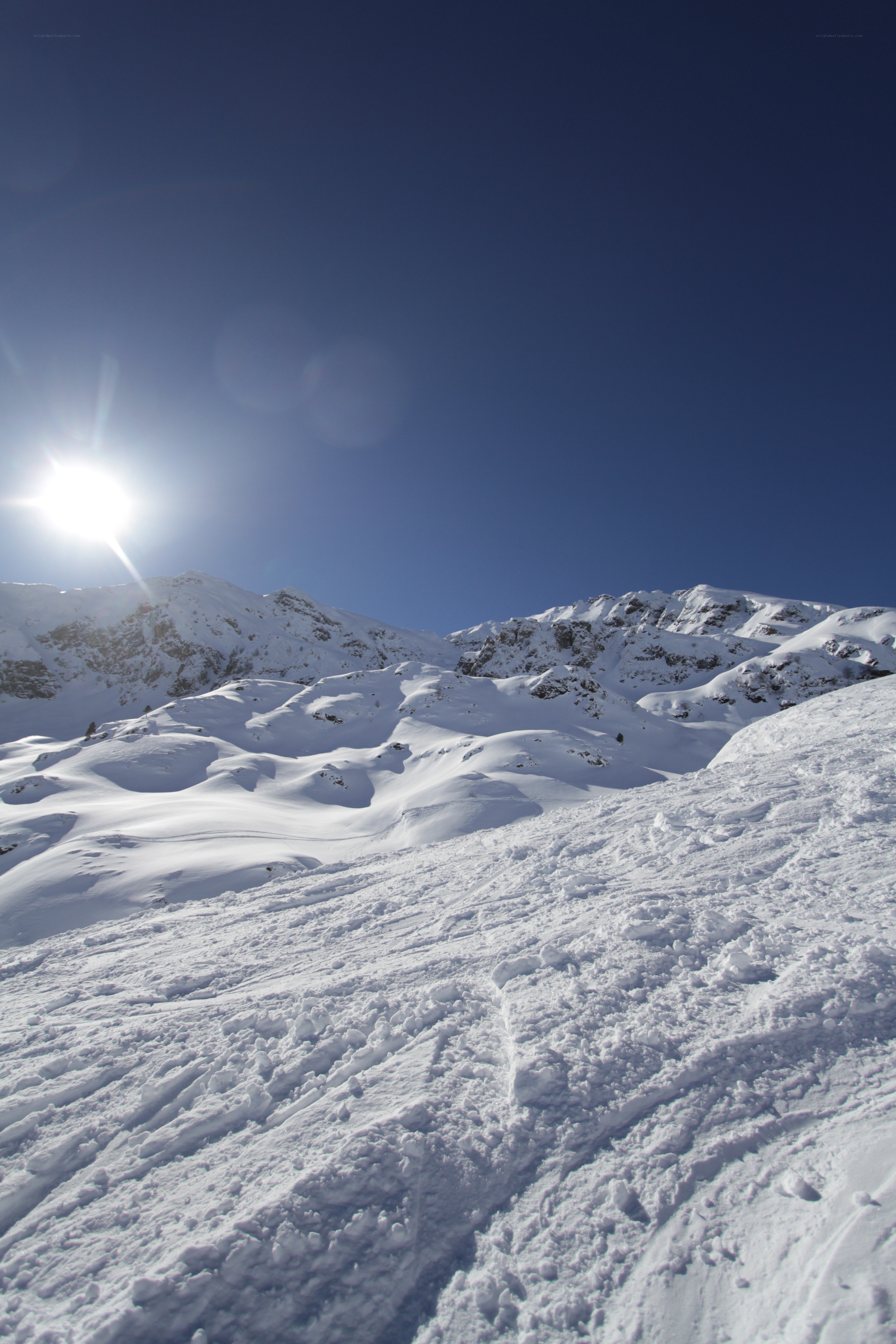 Sunlit snowy mountain peak