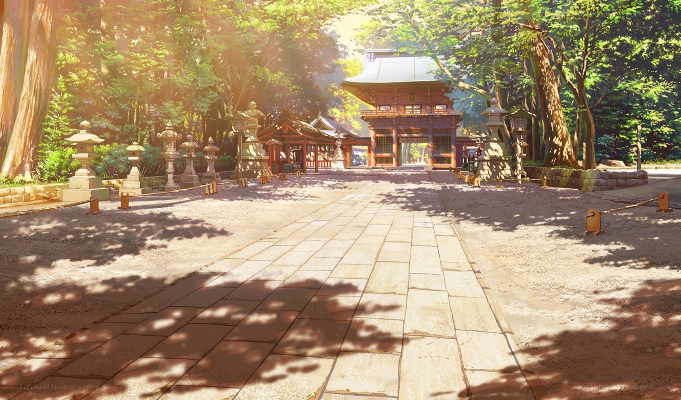 Sunlit temple path in forest