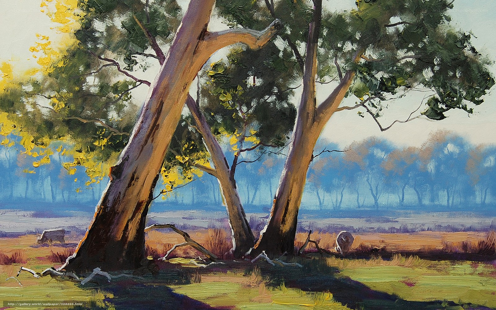 Sunlit trees in a misty field