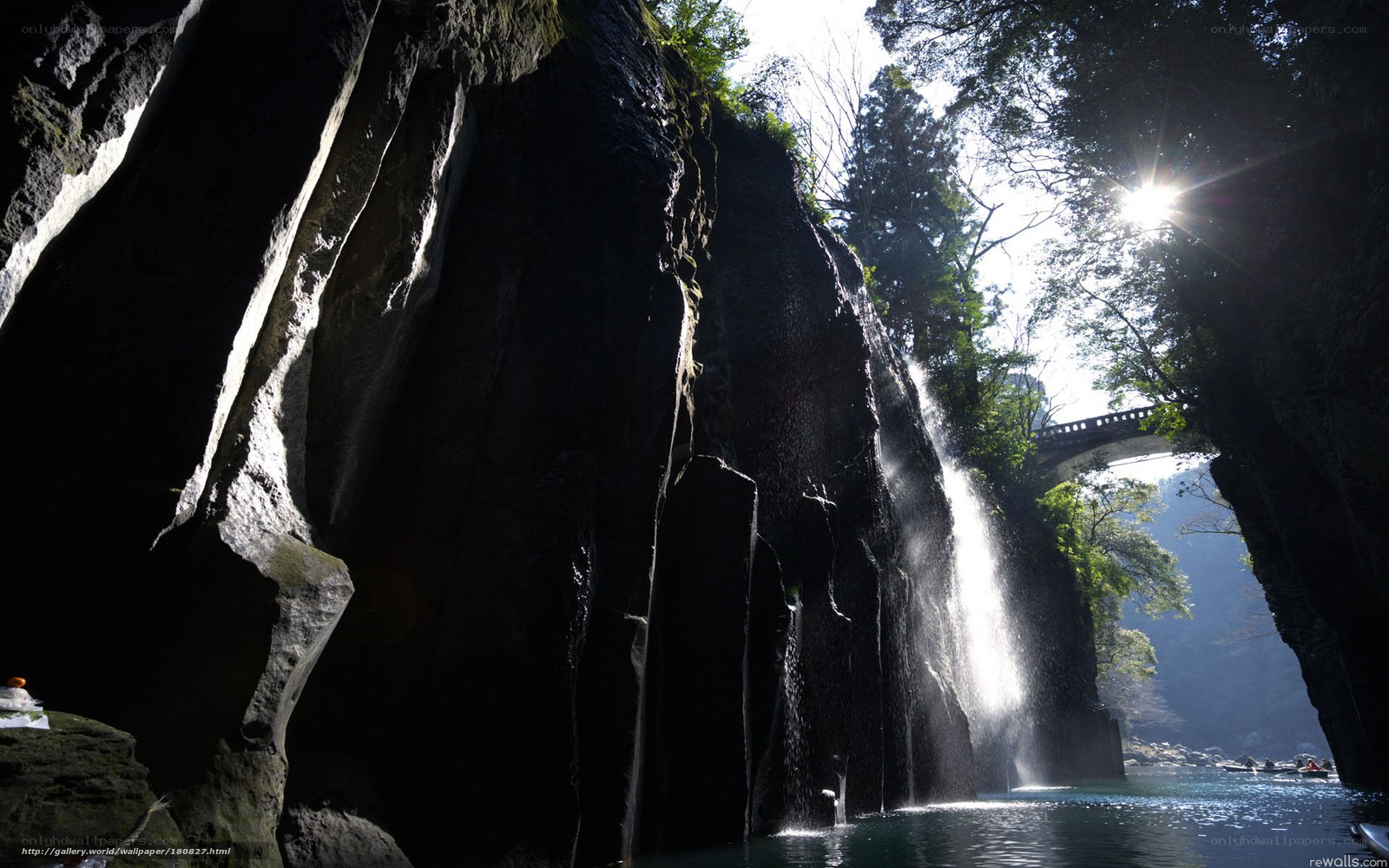 Sunlit waterfall in a canyon