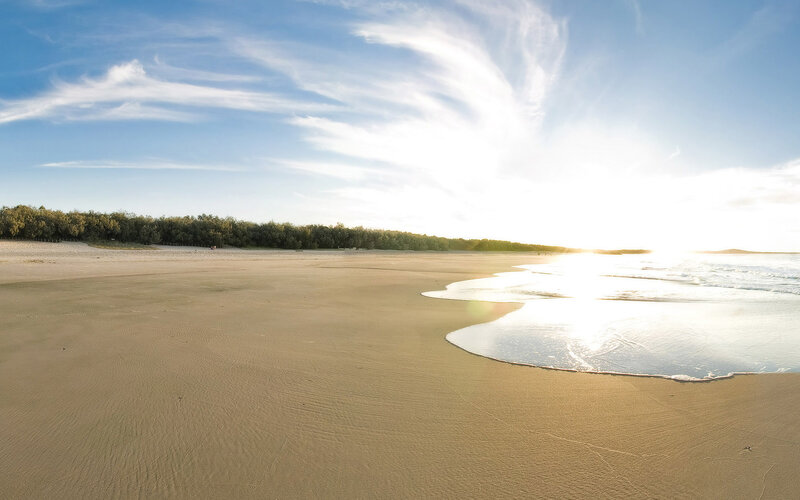 sunny beach at sunset