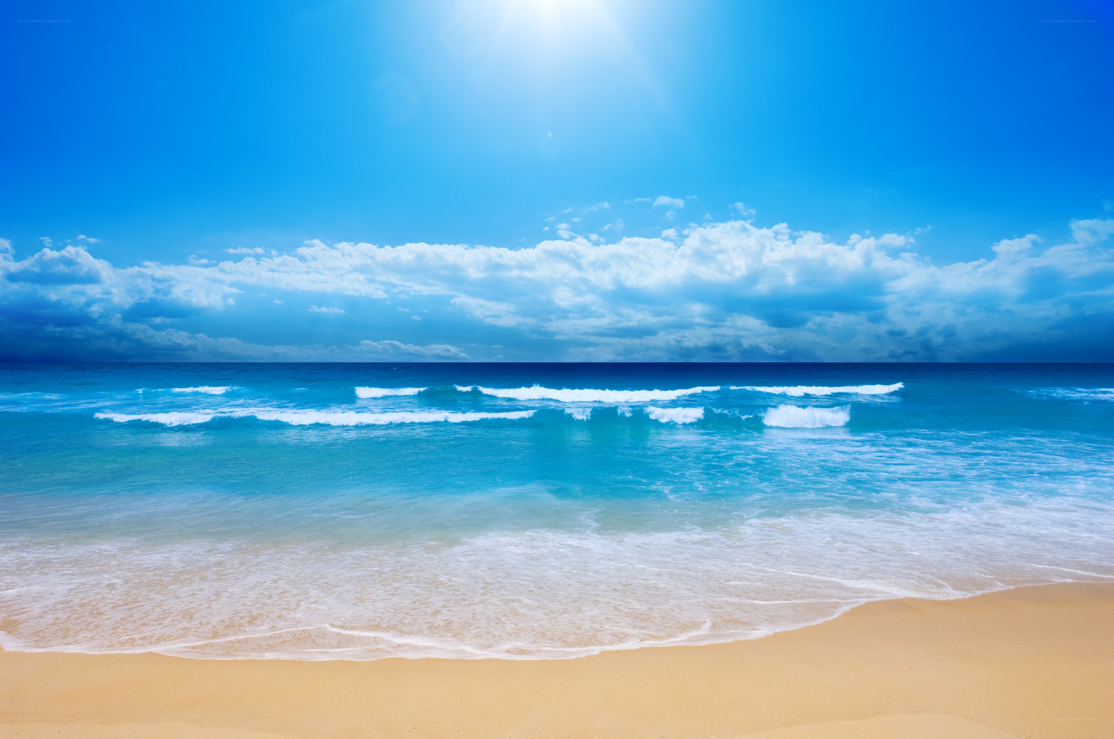 Sunny beach with blue sky
