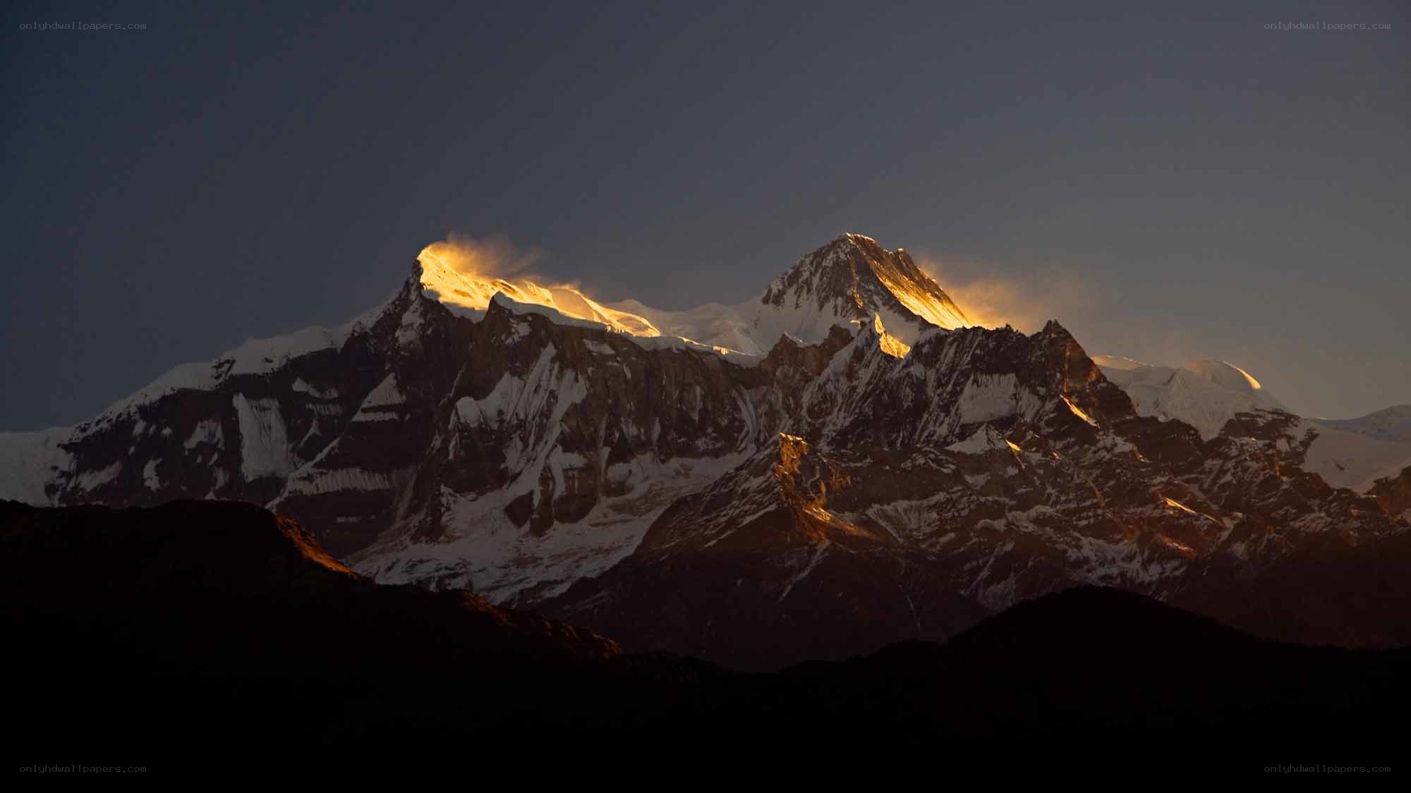 Sunrise on snow-capped mountains