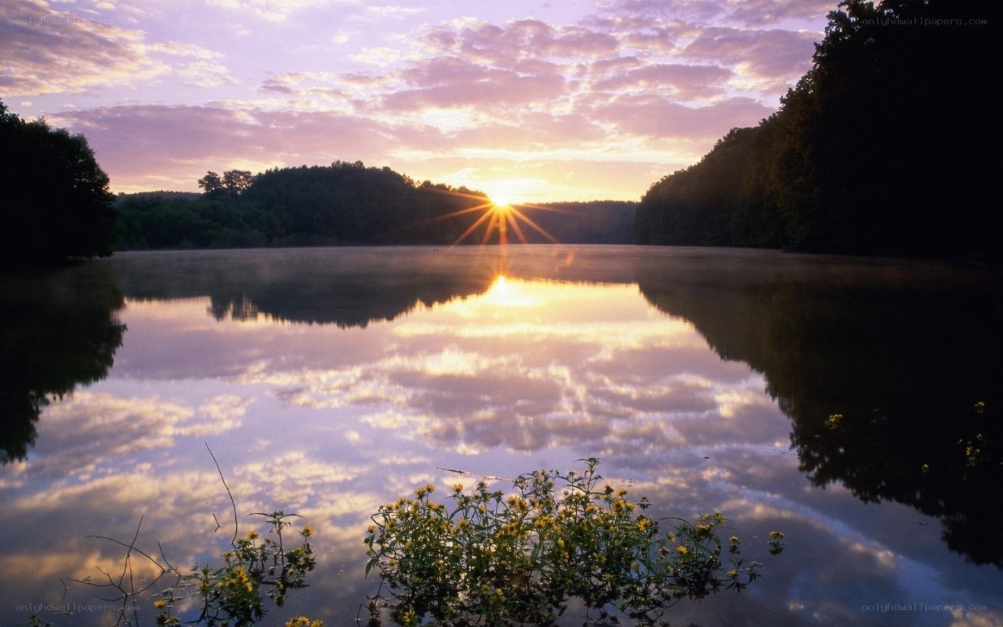 Sunrise over a calm lake