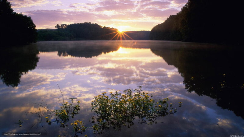 Sunrise over a calm lake