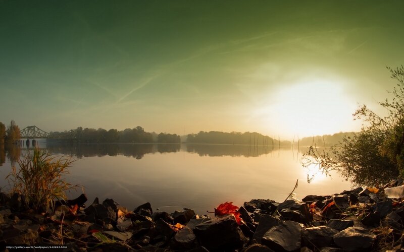 Sunrise over a calm river