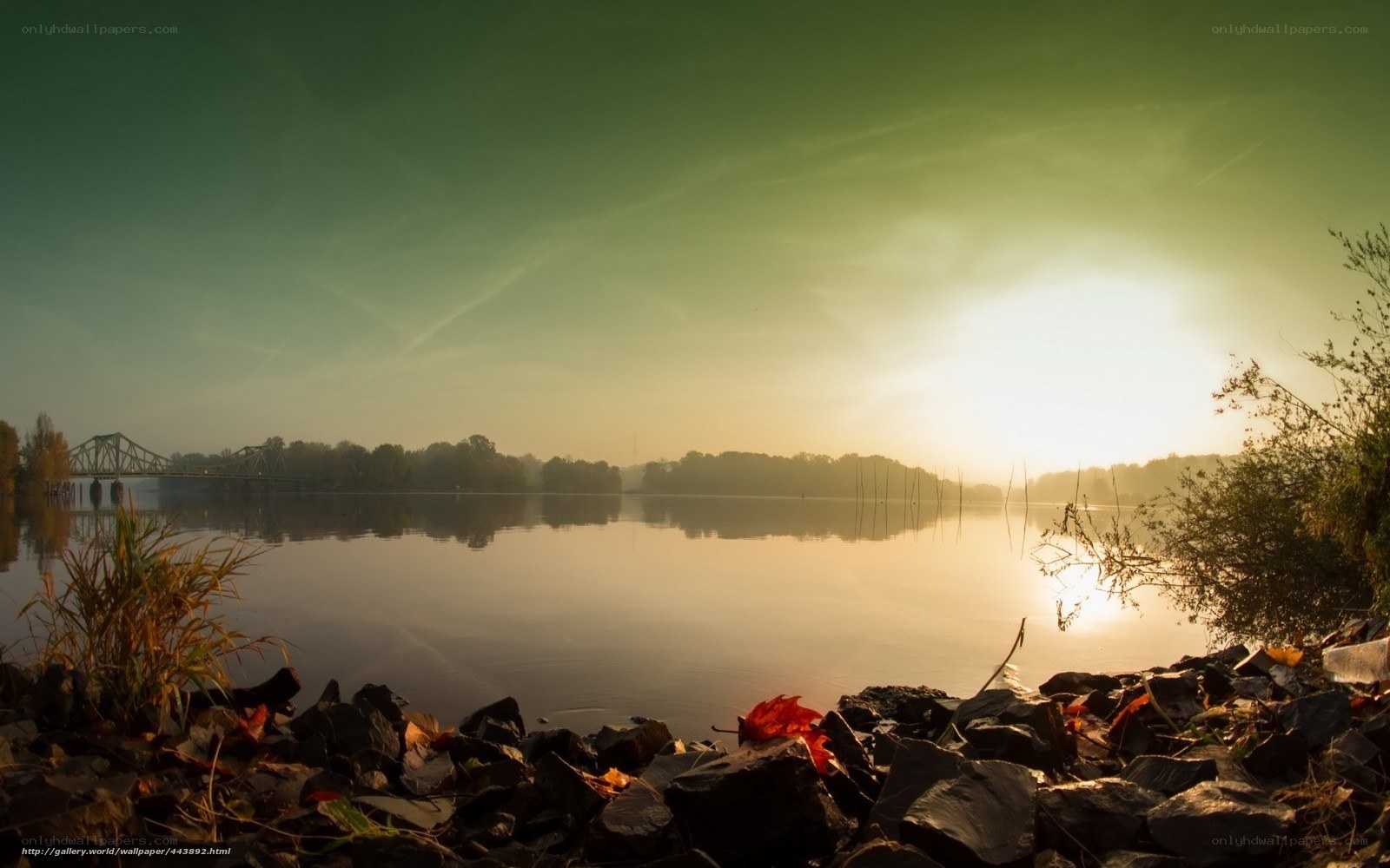 Sunrise over a calm river