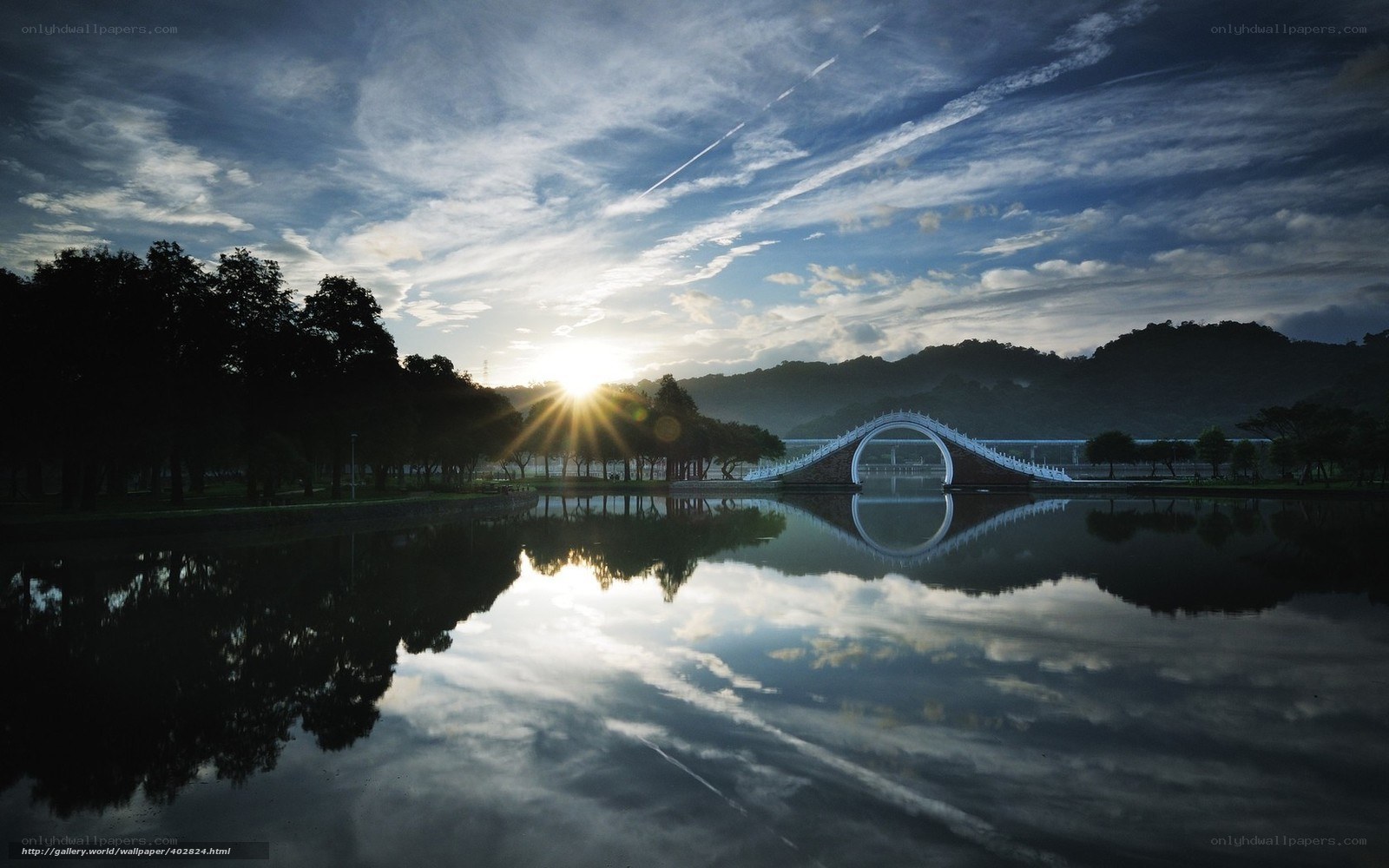 Sunrise over a curved bridge