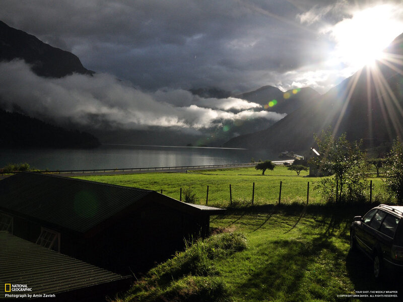 Sunrise over a fjord landscape
