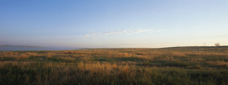 Sunrise over a grassy plain
