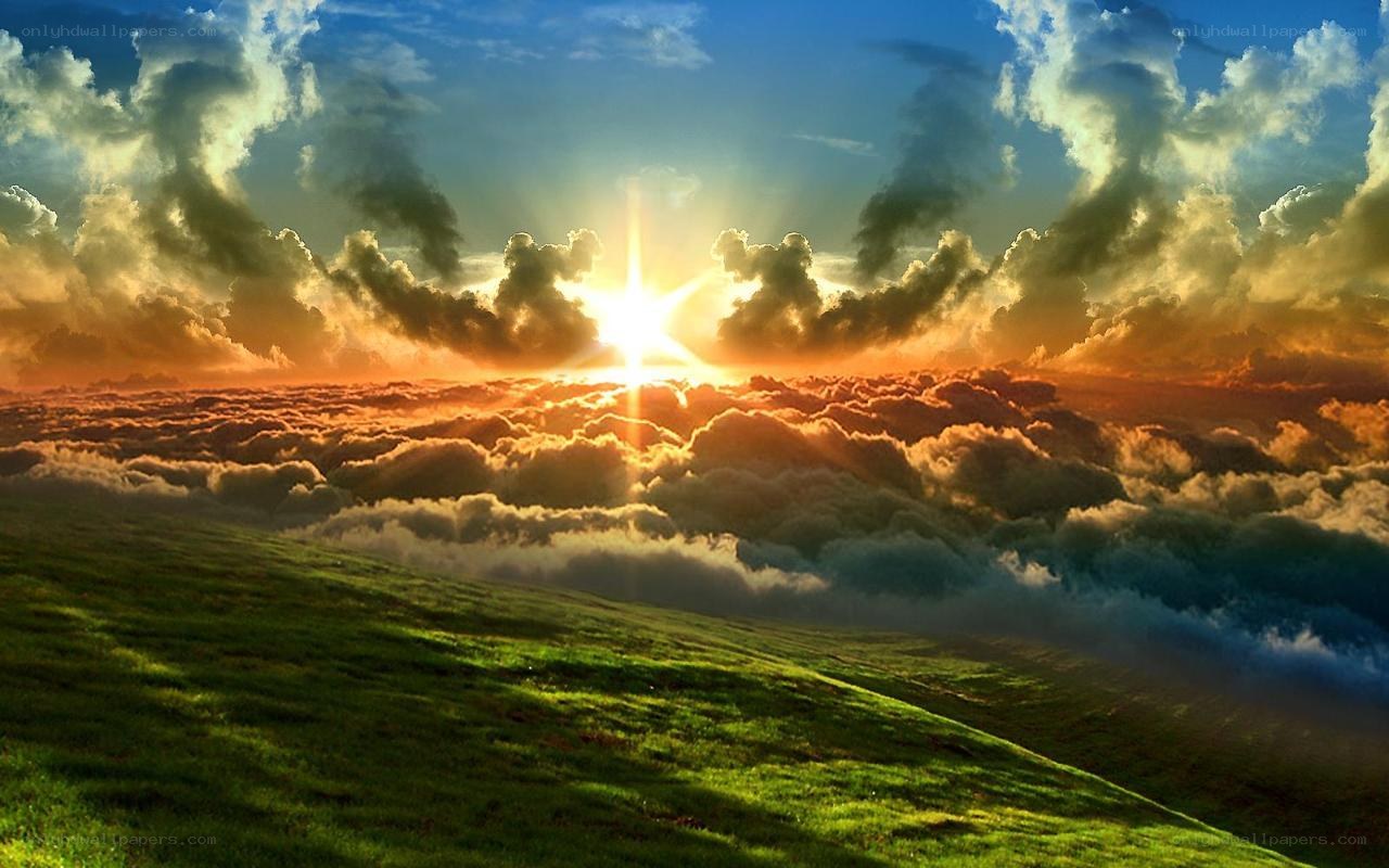 Sunrise over a green hill