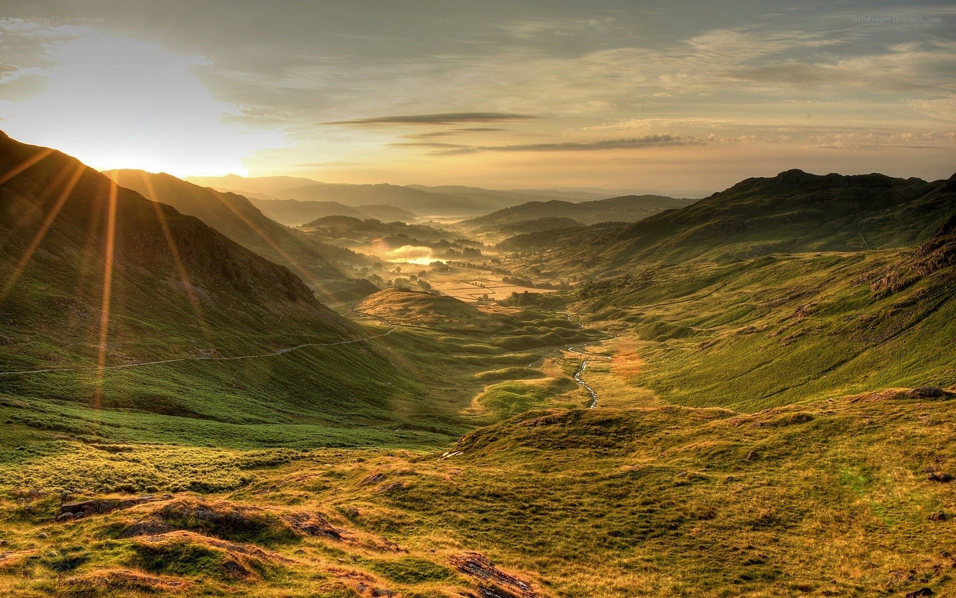 Sunrise over a green valley