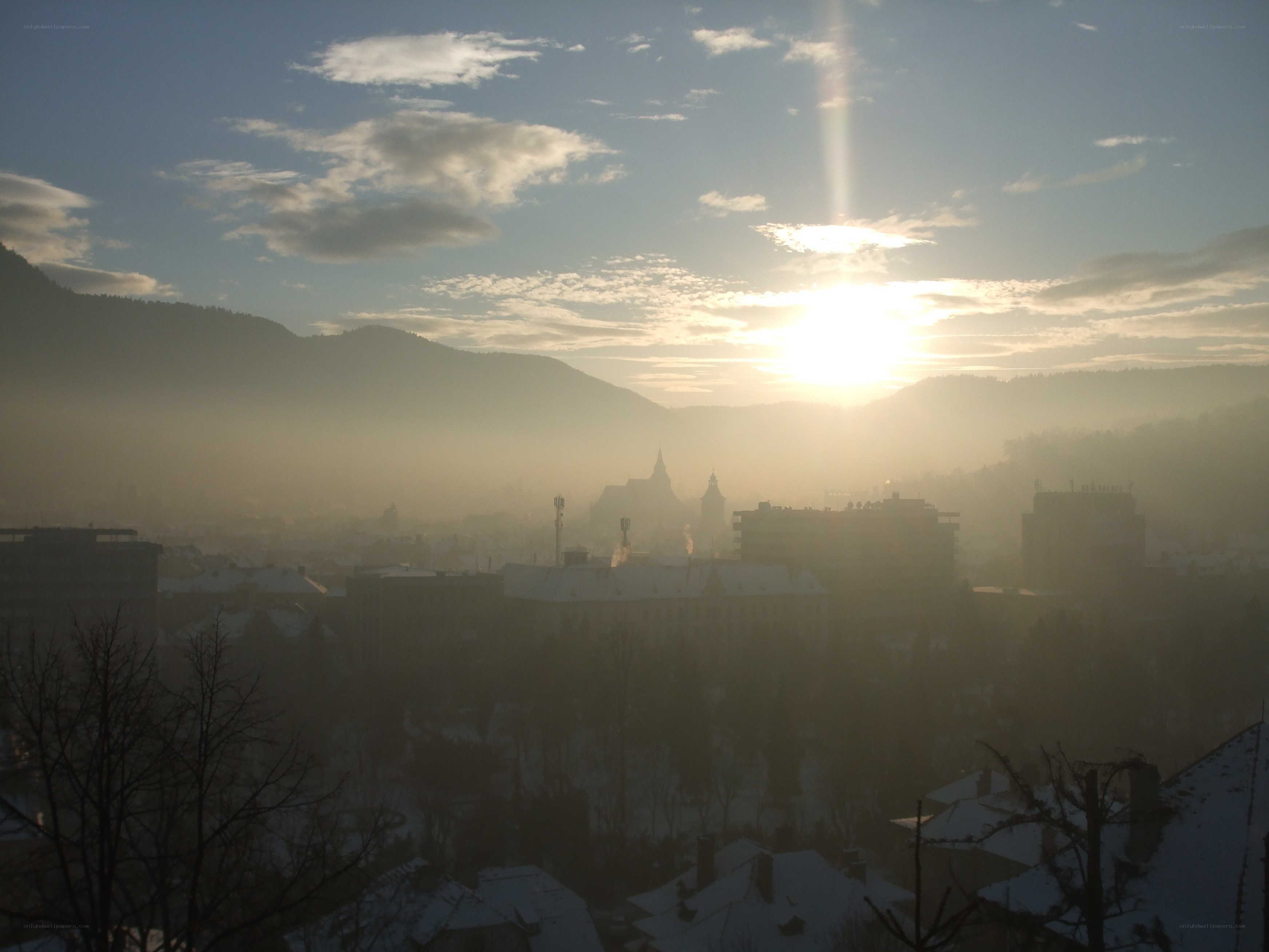 Sunrise over a misty city