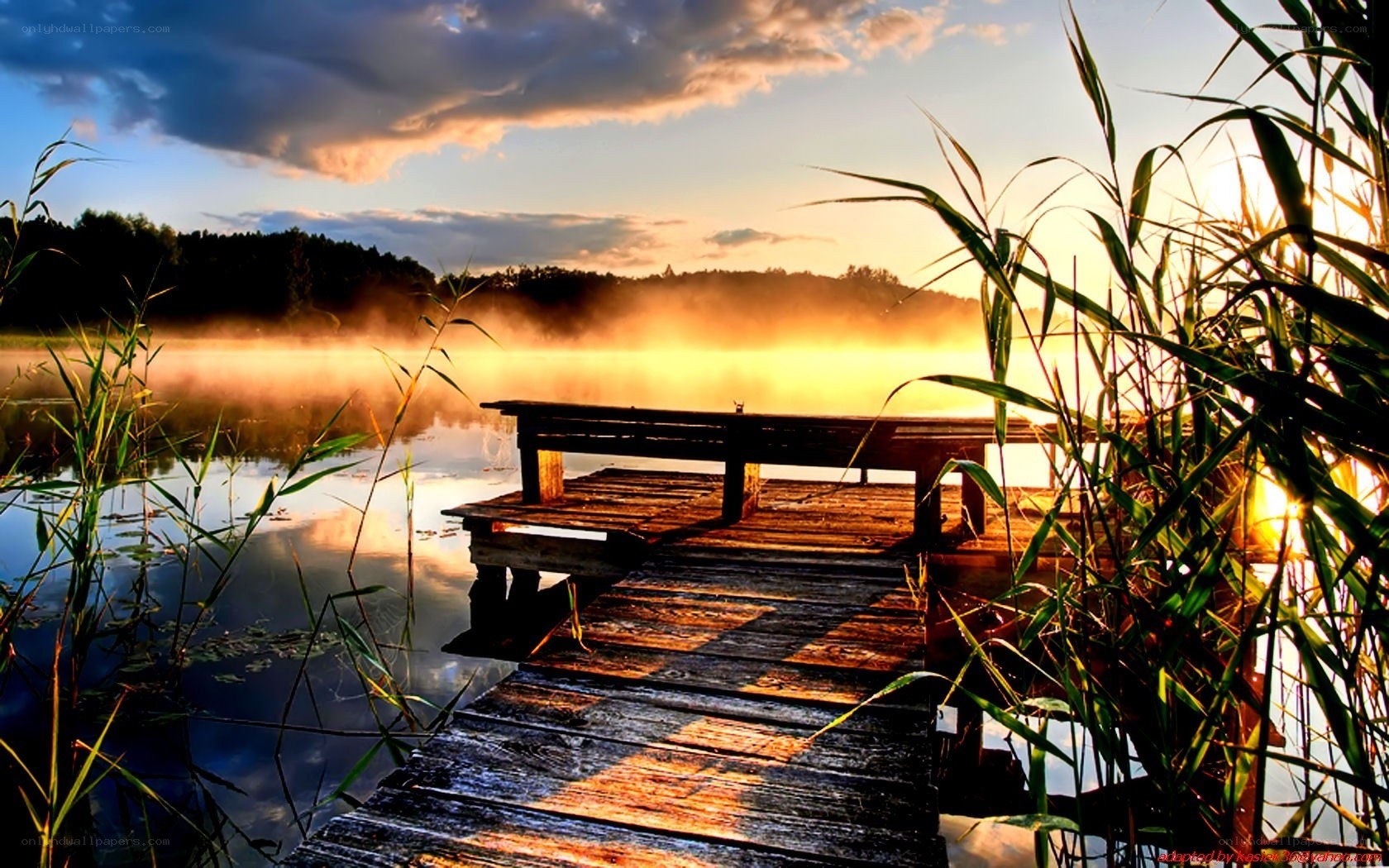 Sunrise over a misty lake