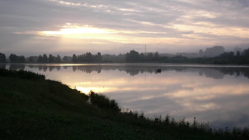 Sunrise over a misty lake