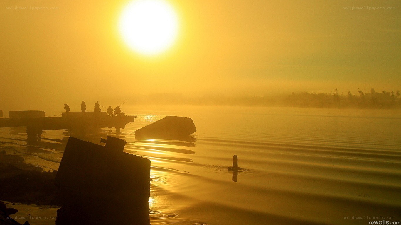 Sunrise over a misty lake