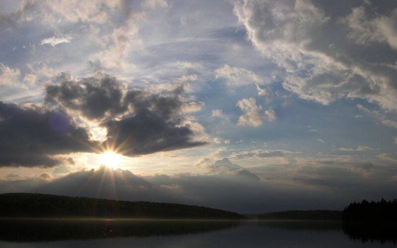 Sunrise over a misty lake