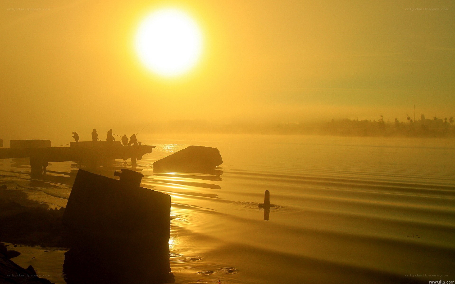 Sunrise over a misty lake