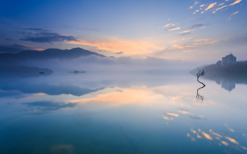 Sunrise over a misty lake