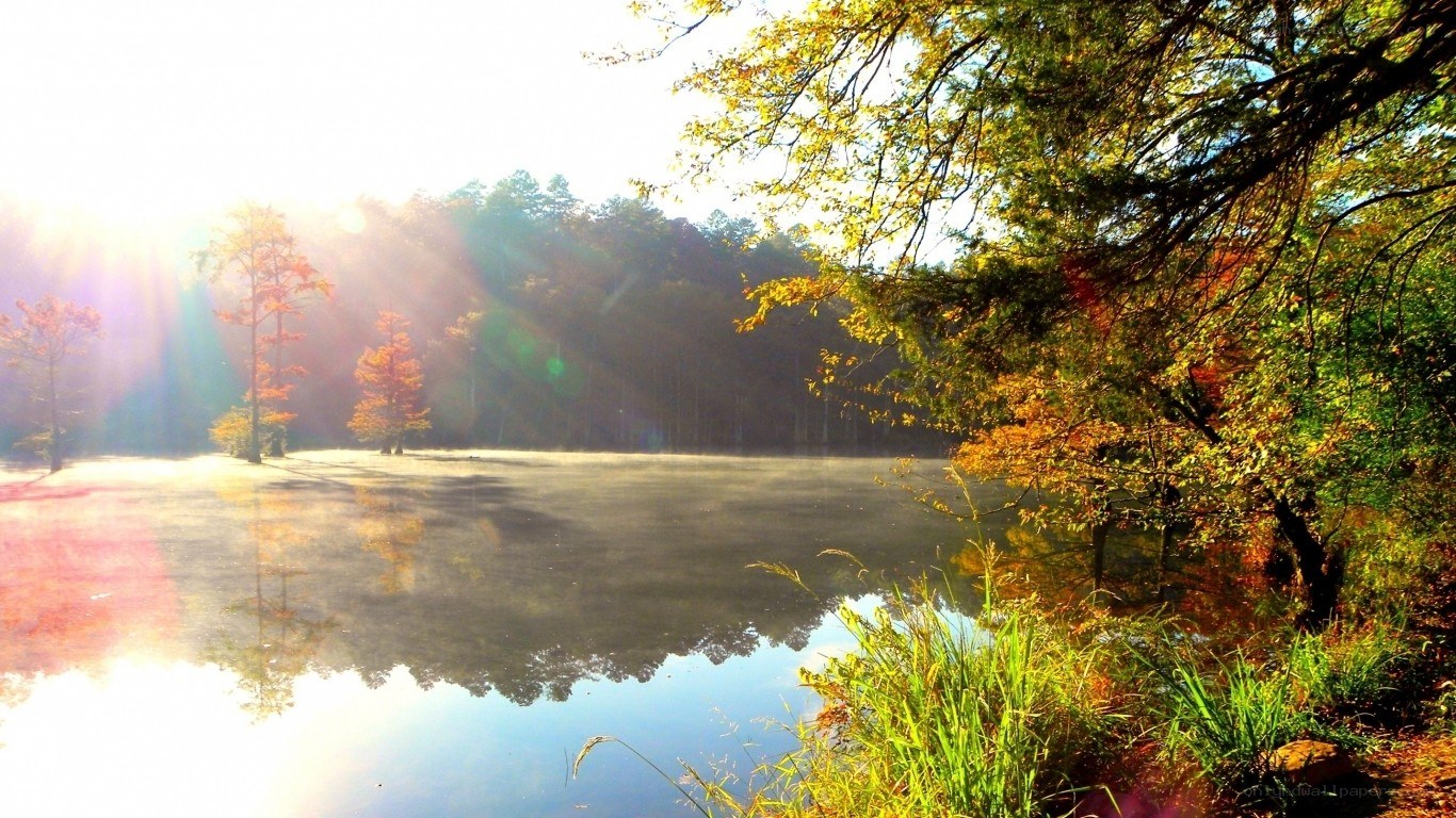 Sunrise over a misty lake