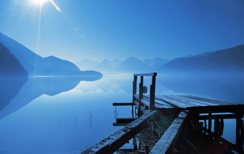 Sunrise over a misty lake